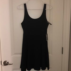 Black sleeveless skater dress